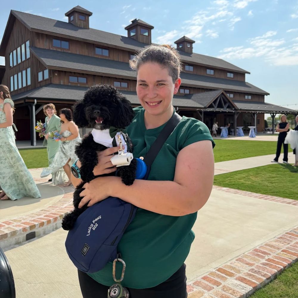 Owner of Lucky Paws with a dog in Our Bryan–College Station Pet Care Service Area_